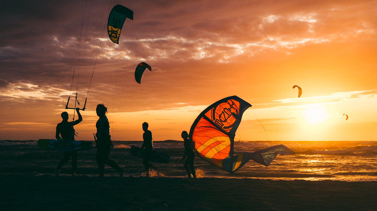 Kitesurfers enjoying financial freedom